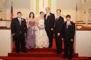Karl and Nancy's wedding day. A photo of the wedding party in the church.