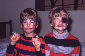Karl and Adam dressed up for Halloween. Adam has an eyepatch in this photo.