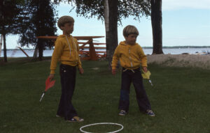 Karl and Adam posing with lawn darts, one of the most deadly toys ever invented.